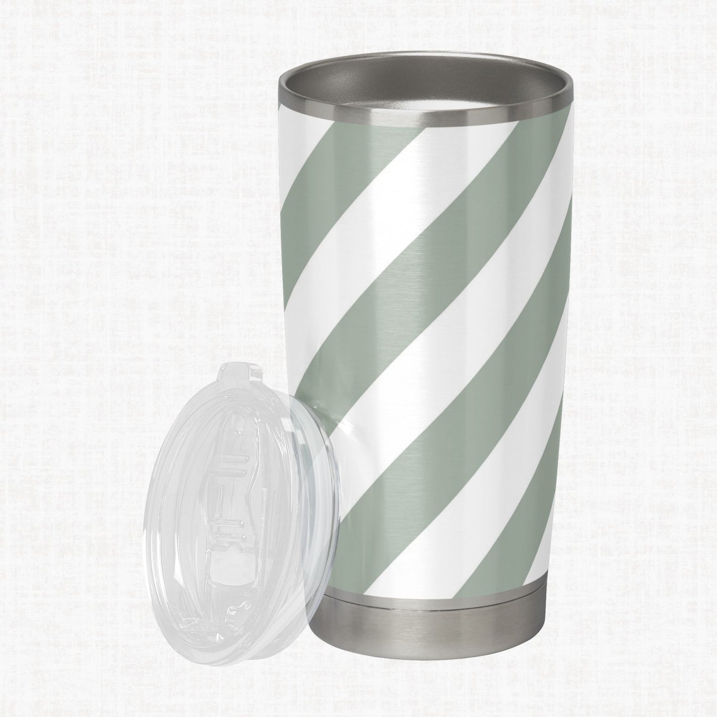 Sage green and white wide diagonal stripe pattern shown on a stainless steel tumbler as a product-use example.