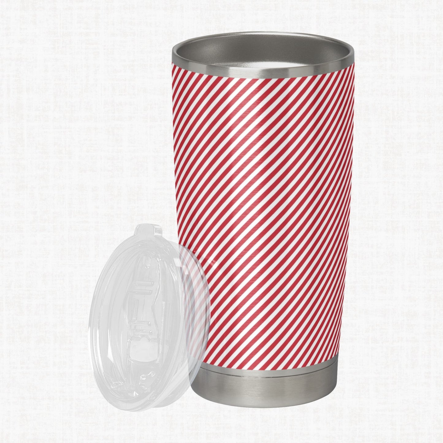 Red and white wide diagonal stripe pattern shown on a stainless steel tumbler as a product-use example.