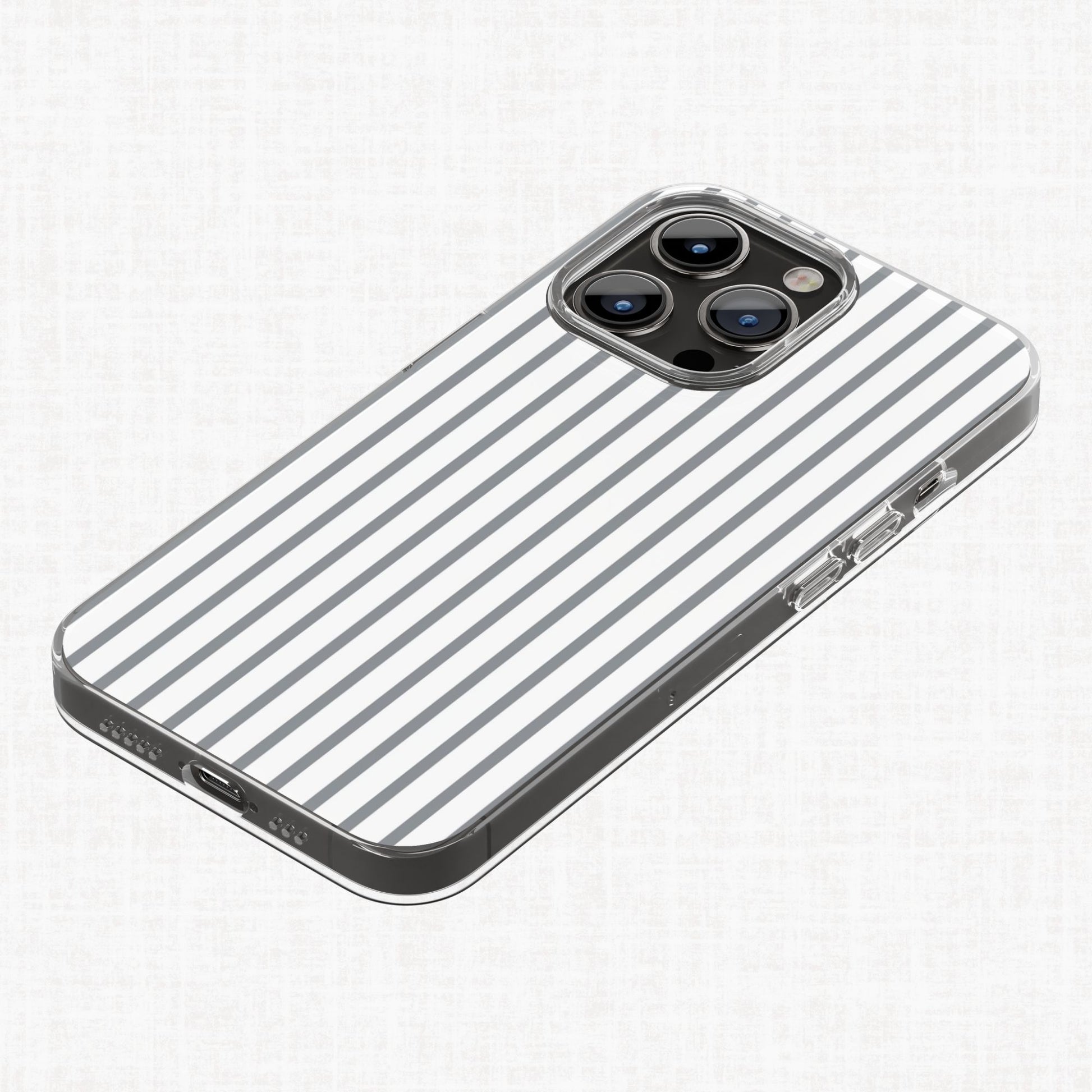 Grey and white striped Essential Geo pattern shown on a mockup of a clear phone case
