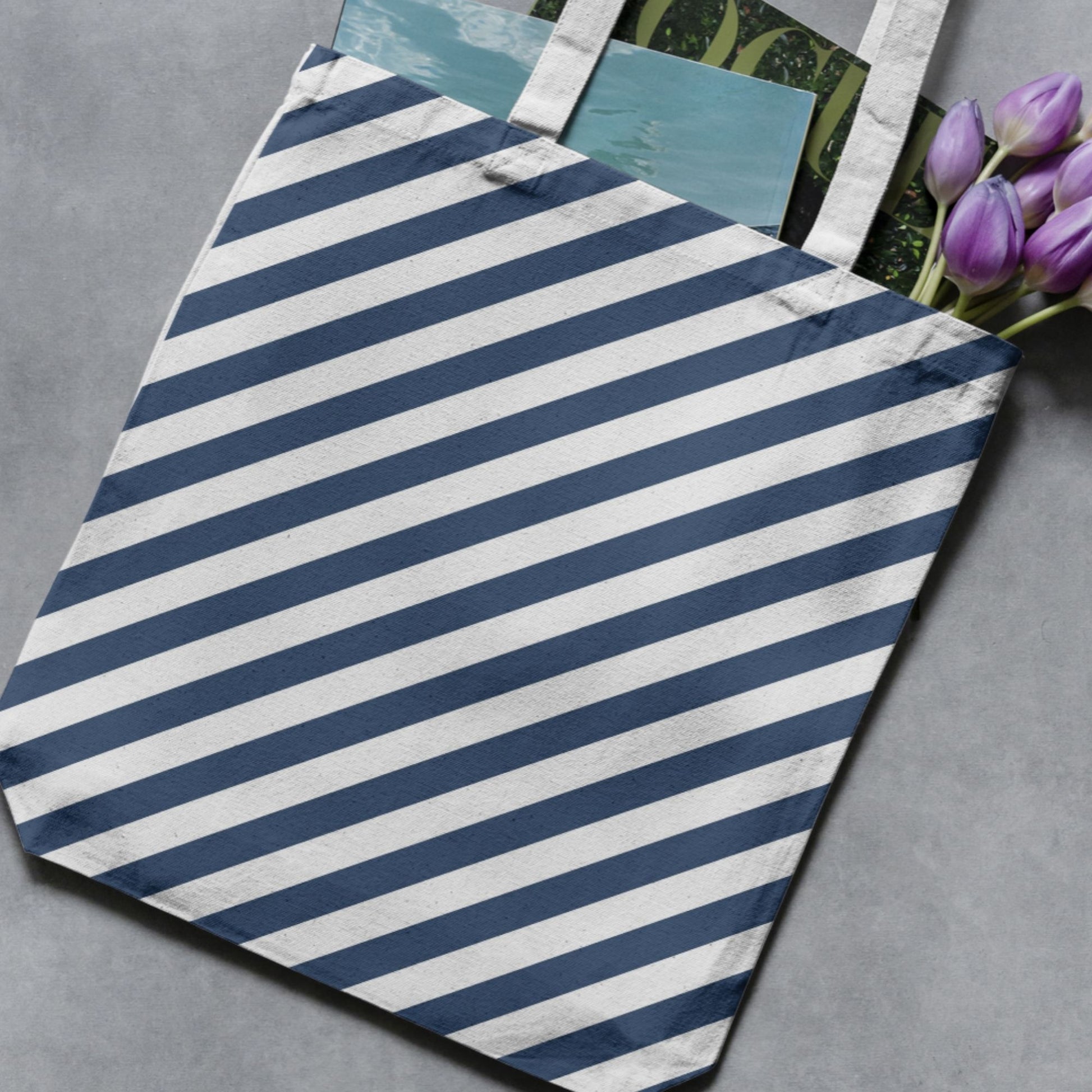 Navy and white wide vertical stripe pattern shown on a tote bag as a product-use example.