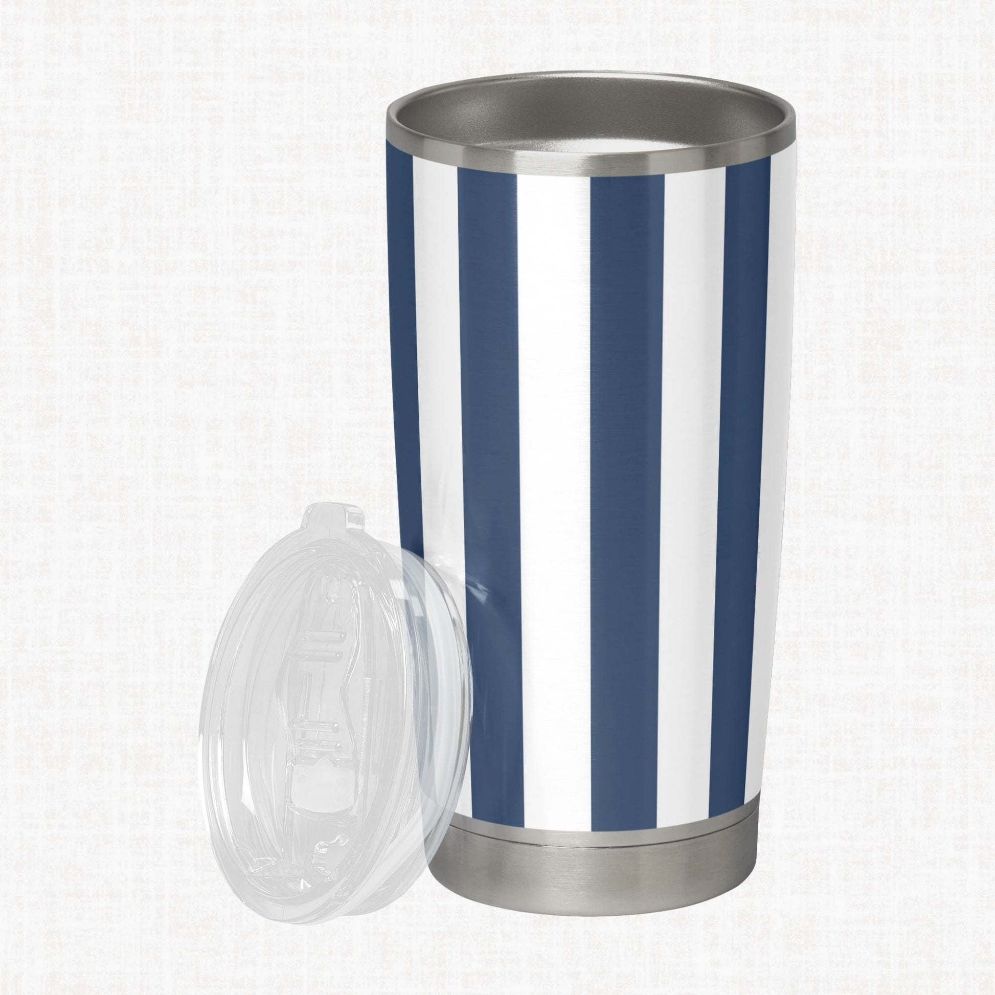 Navy and white wide diagonal stripe pattern shown on a stainless steel tumbler as a product-use example.