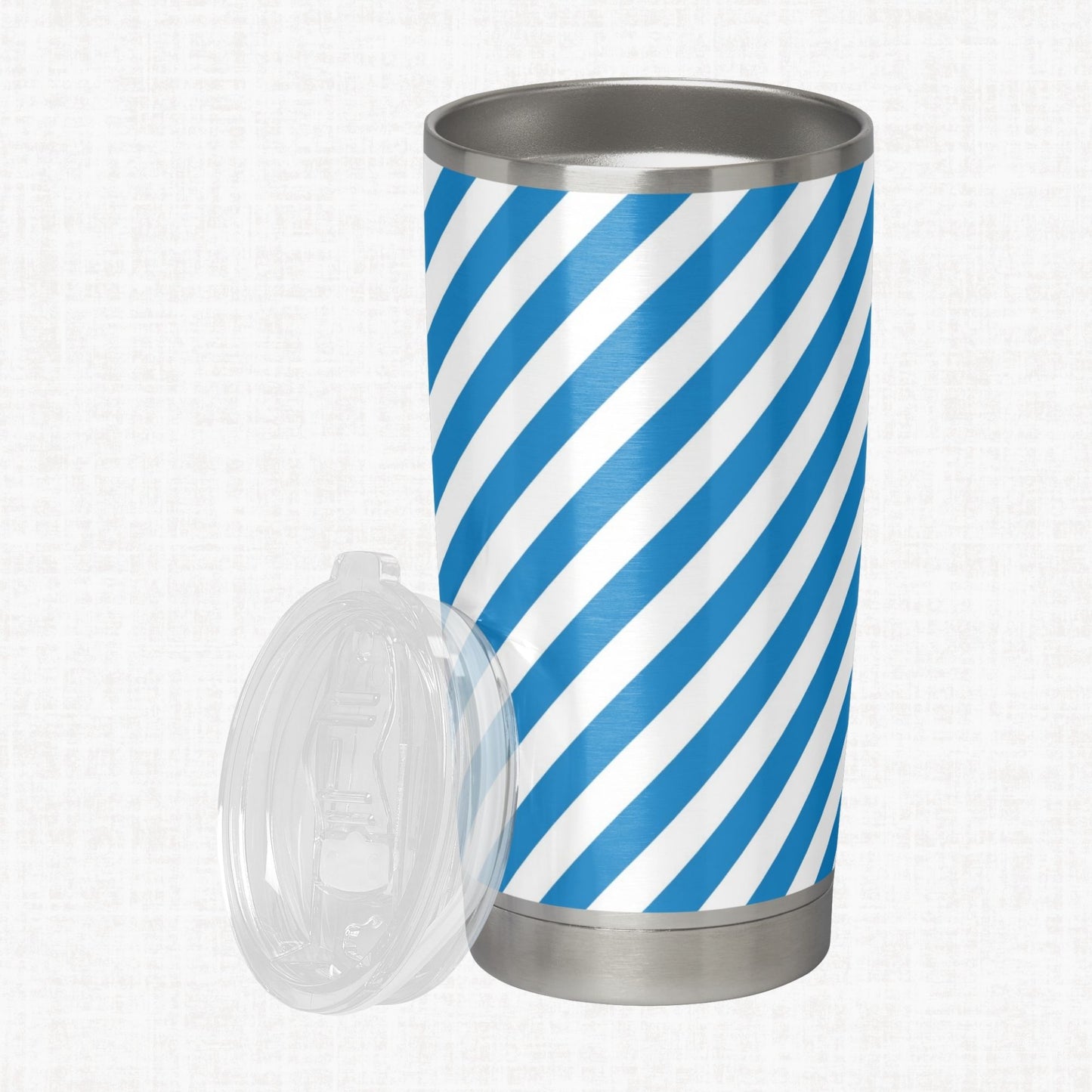 French blue and white wide diagonal stripe pattern shown on a stainless steel tumbler as a product-use example.