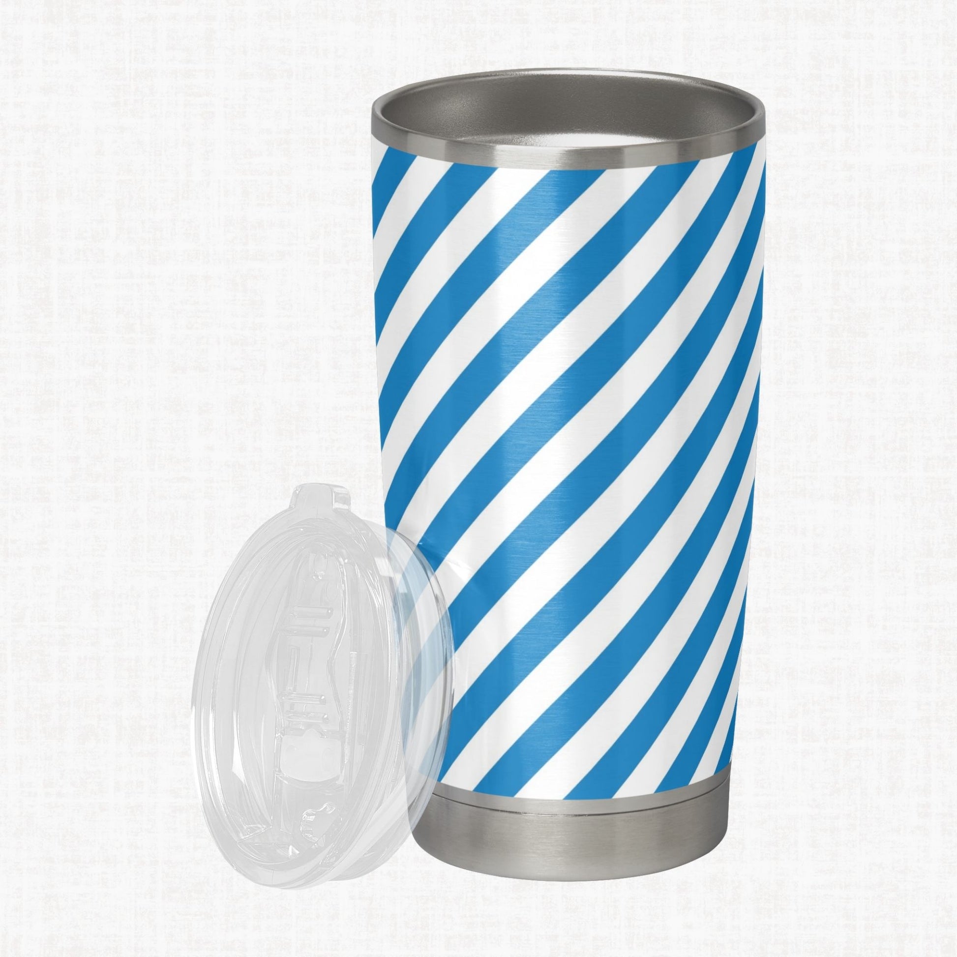 French blue and white wide diagonal stripe pattern shown on a stainless steel tumbler as a product-use example.