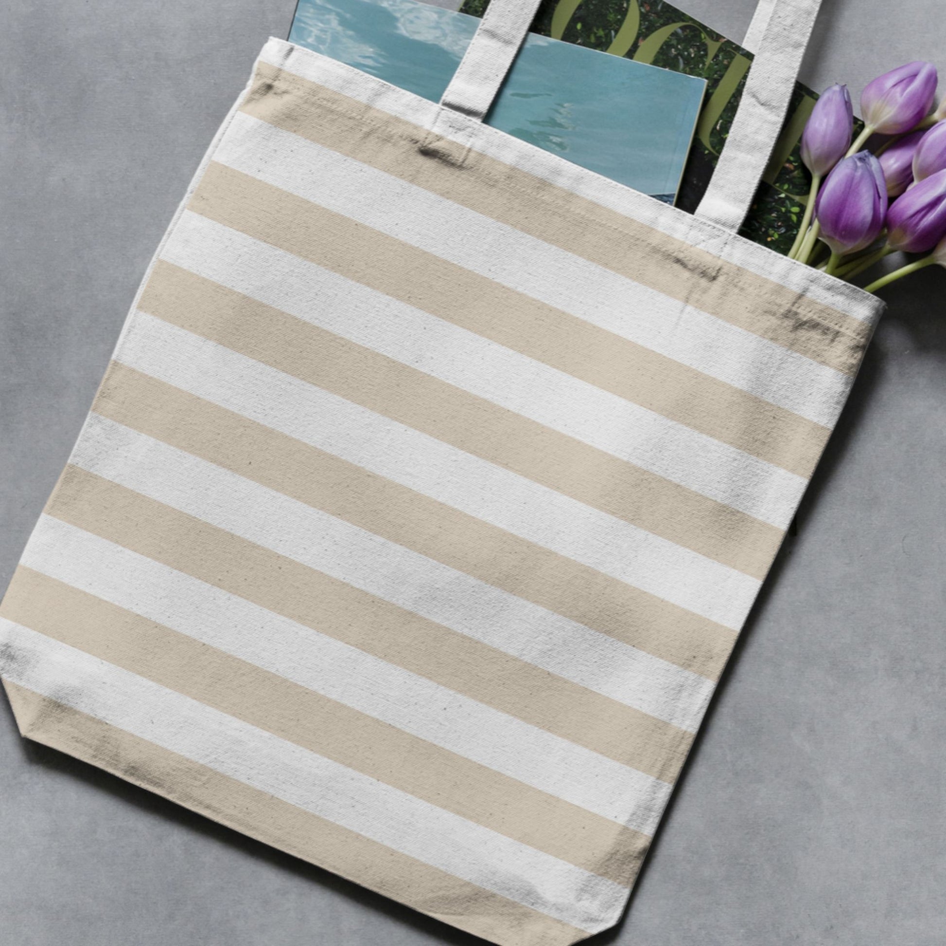 Cream and white wide vertical stripe pattern shown on a tote bag as a product-use example.