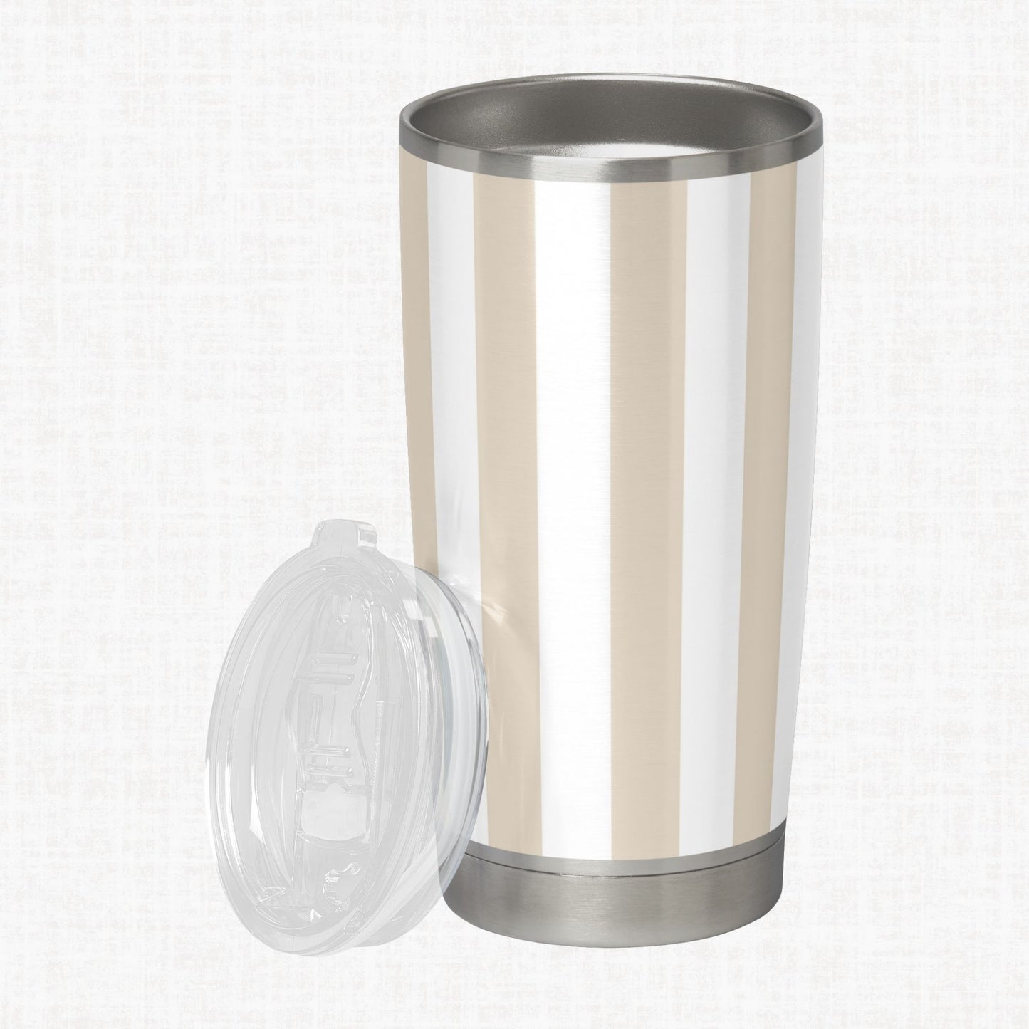 Cream and white wide diagonal stripe pattern shown on a stainless steel tumbler as a product-use example.